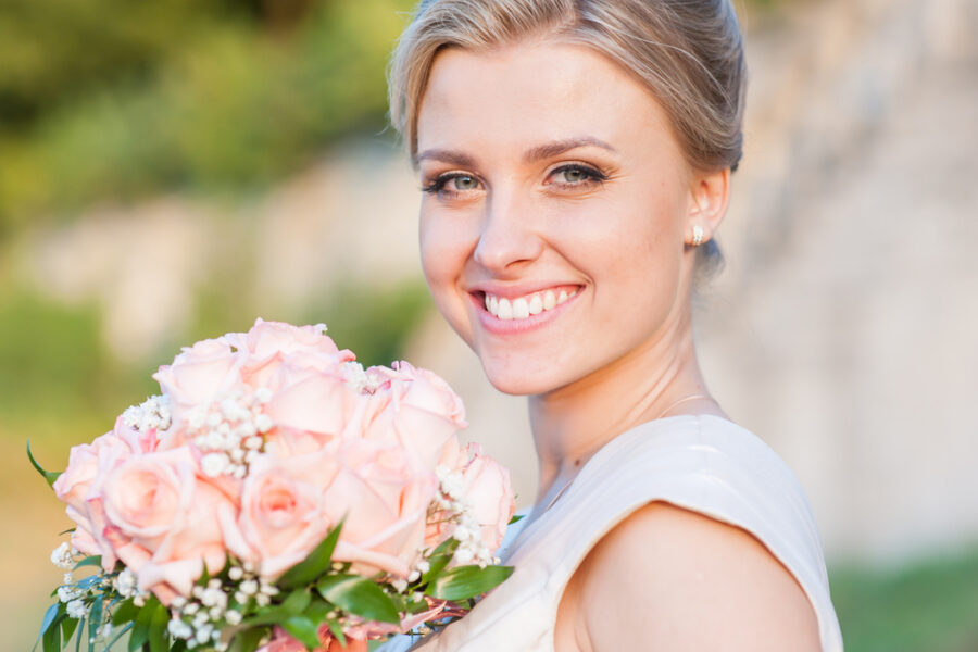 Bride with a confident smile after braces or Invisalign before wedding
